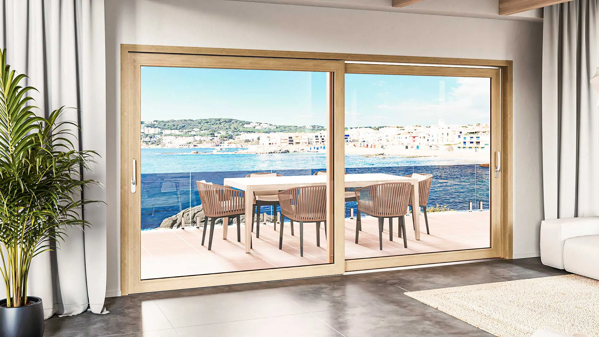 Ventana corredera de gran formato abierta a una terraza con vistas al mar